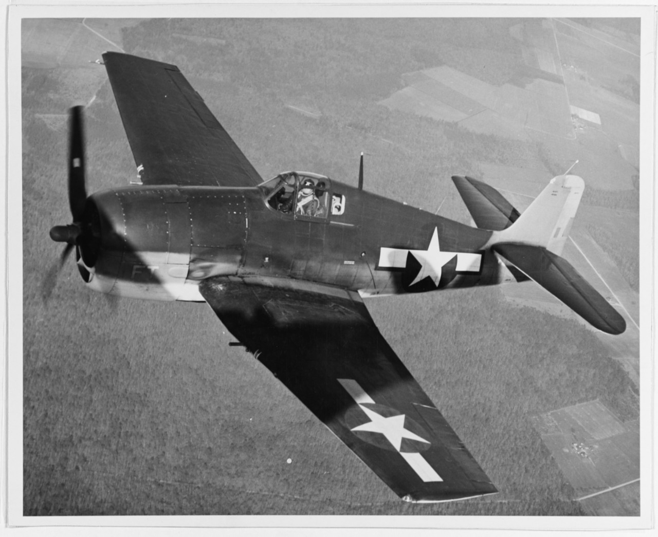 Photo of F6F-3 over Patuxent Test Center